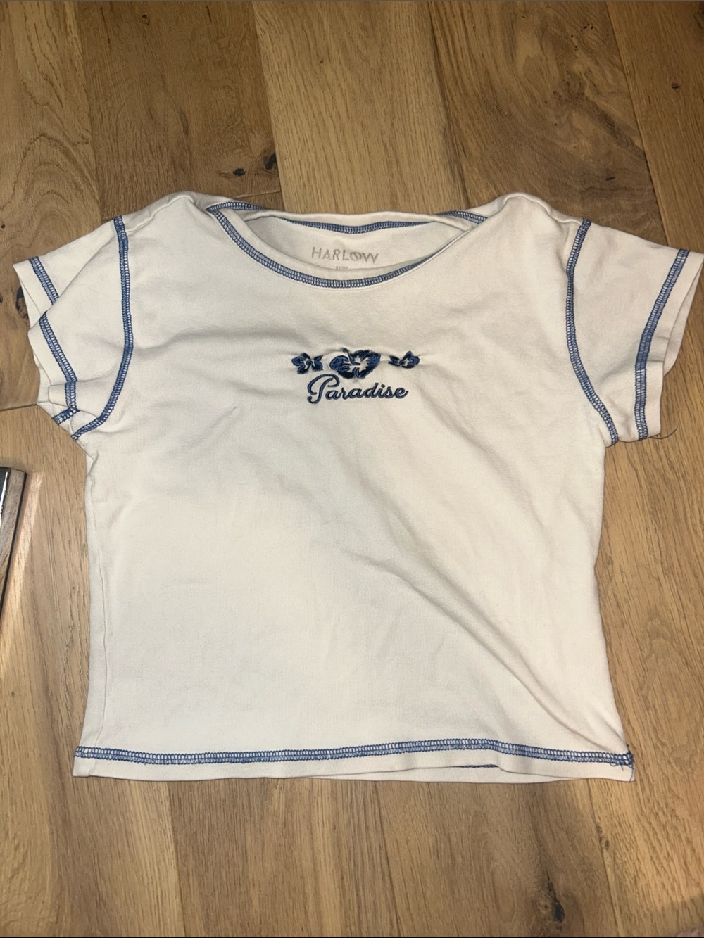 Harlow Woman’s Paradise' White Baby Tee with Blue Trim